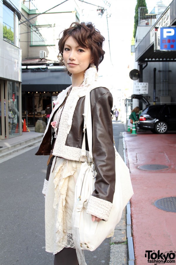 Brown leather jacket and large white vintage bag