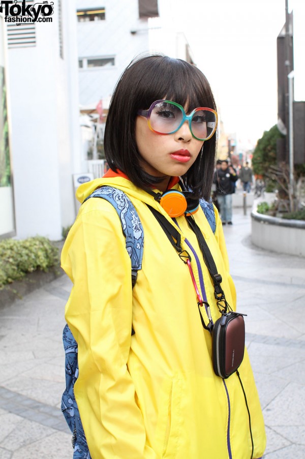 Yellow Uni-glo jacket and rainbow glasses