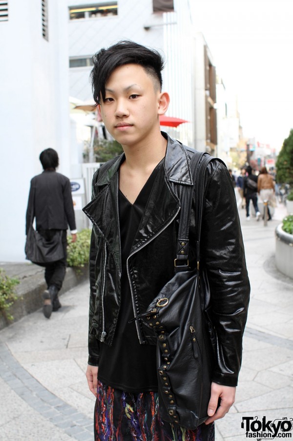 Trendy haircut with black leather jacket and bag