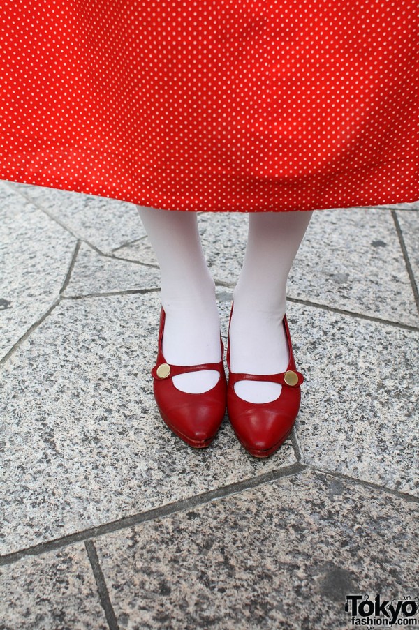 White tights and pointy red shoes