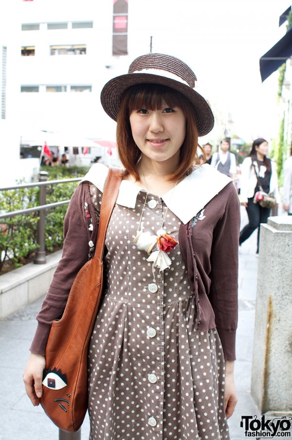 Japanese girl with vintage brown dress and brown straw hat