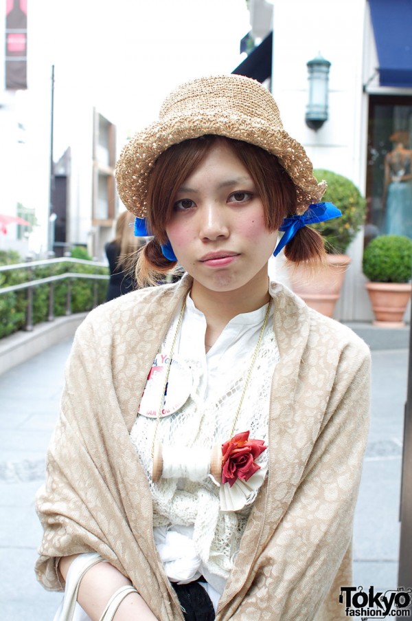 Straw hat and blue hair ribbons