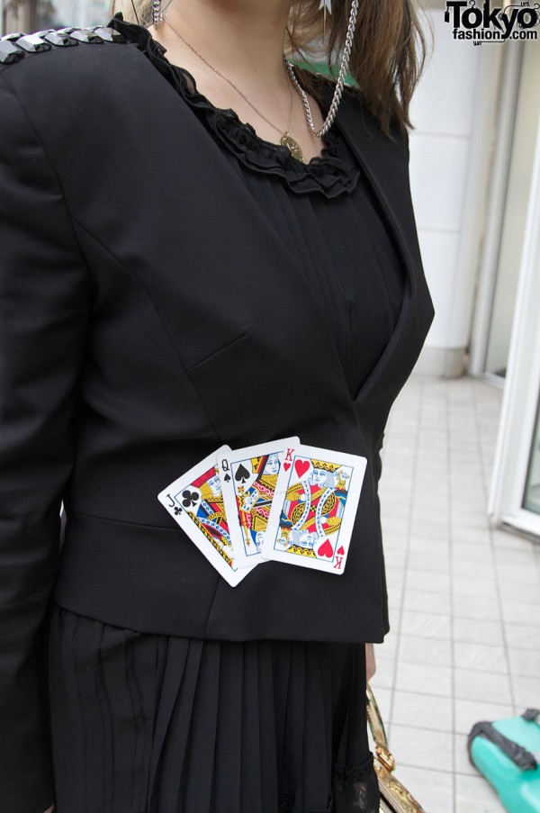 Black jacket decorated with playing cards