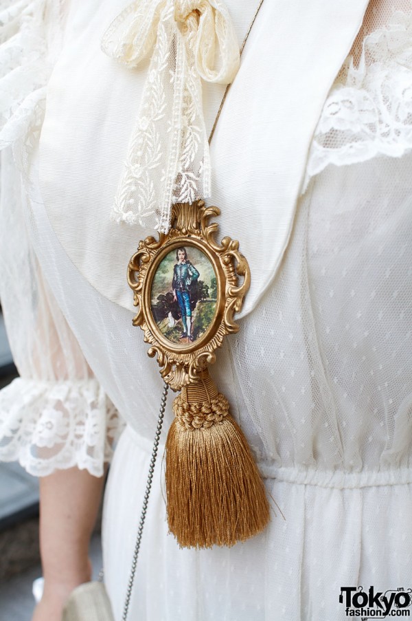 Blue boy locket & gold tassel