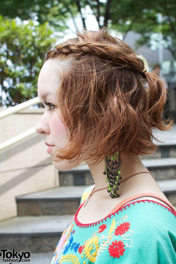 Braided auburn hair & long bead earrings