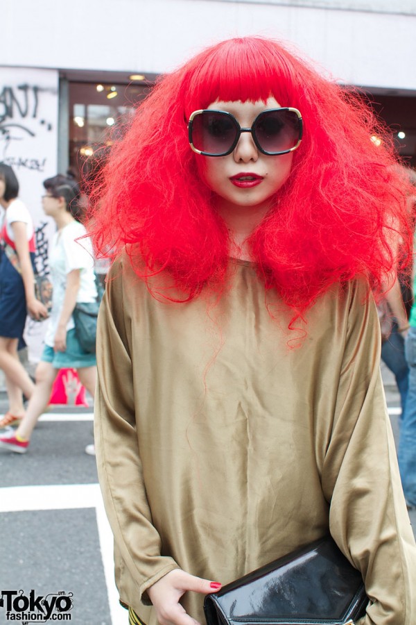 Bright red hair & large sunglasses