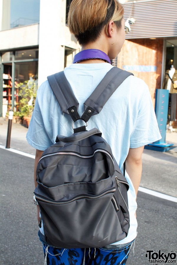 Trendy haircut & gray backpack