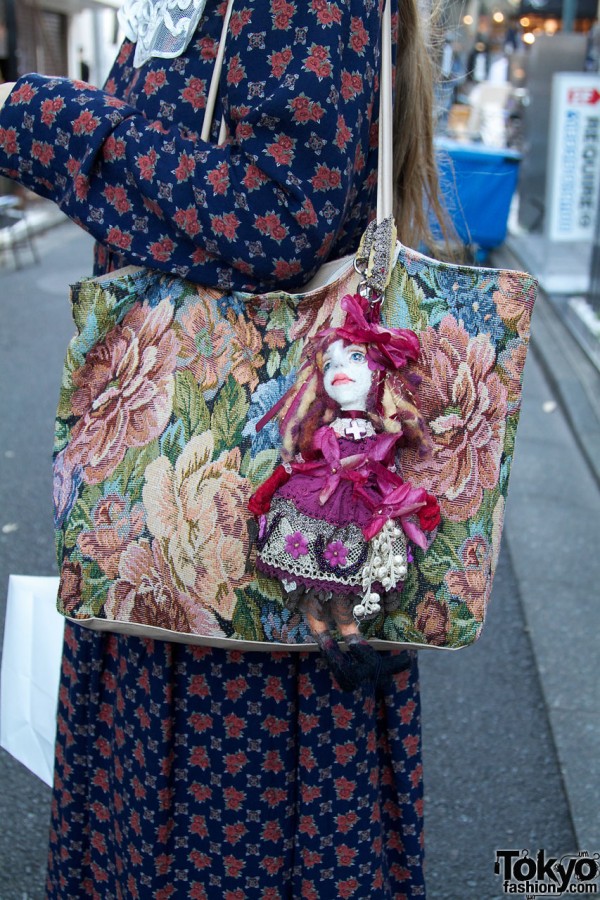 Tapestry bag with doll
