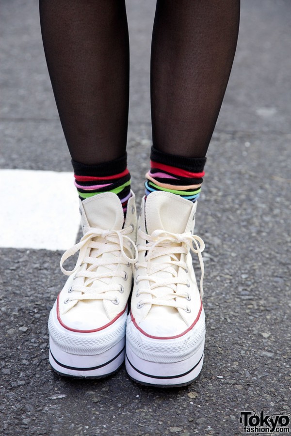 White platform sneakers with multicolored socks