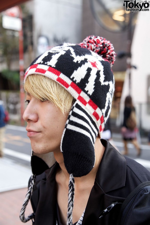 Knit cap with earflaps and pompom