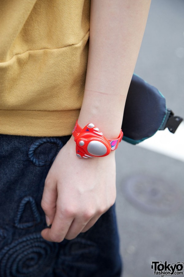 Japanese girl with toy wristwatch
