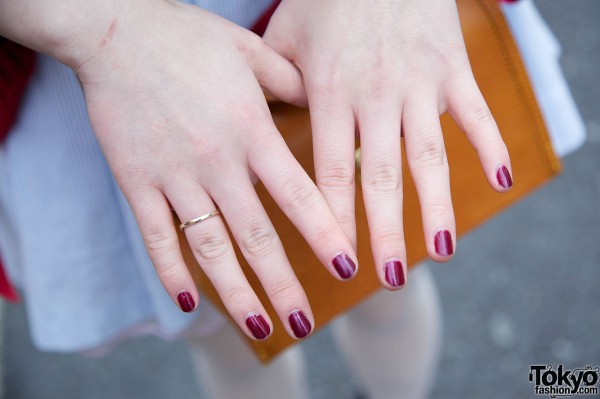 Blood-red nails & delicate ring