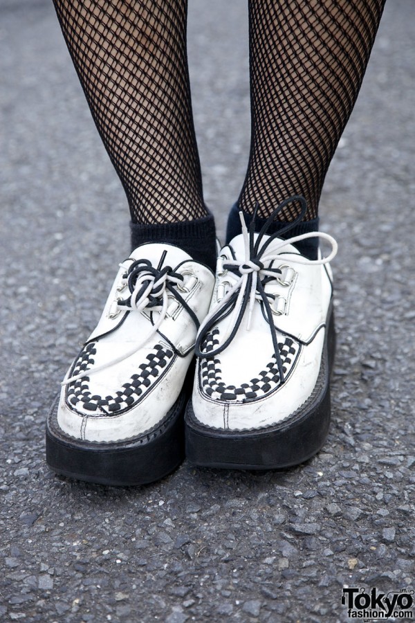 White platform shoes & fishnet stockings