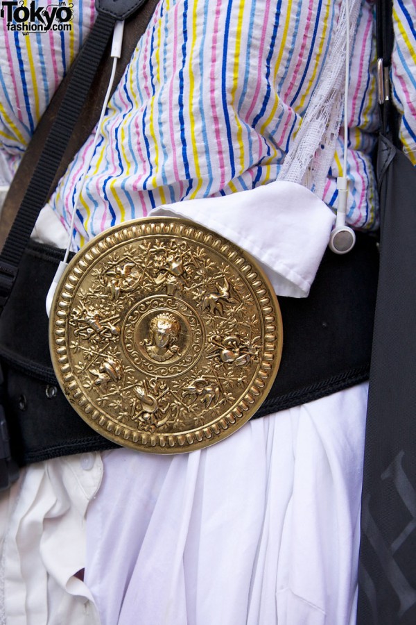 Ornate medallion on belt