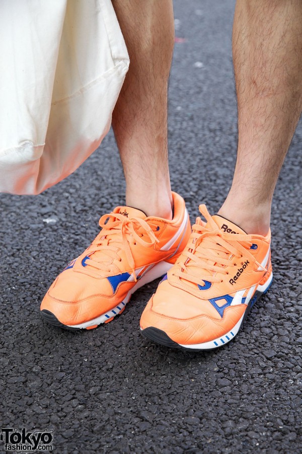 Orange Reebok sneakers