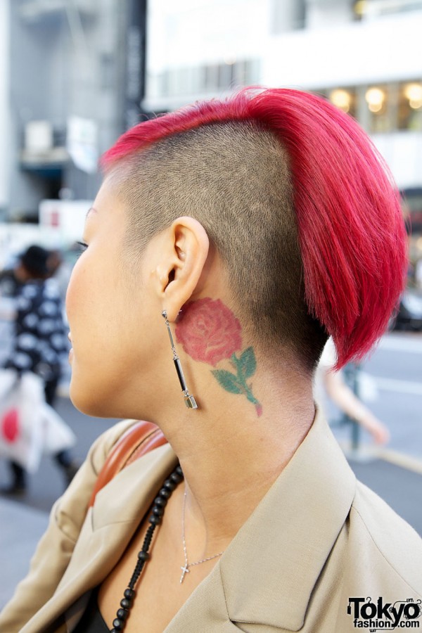 Fuchsia hair, shaved head & rose tattoo