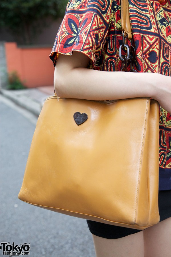 Tan purse with heart cutout from UTA