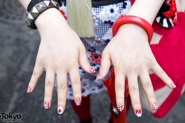 Decorated nails, red bangle & metal stud bracelet