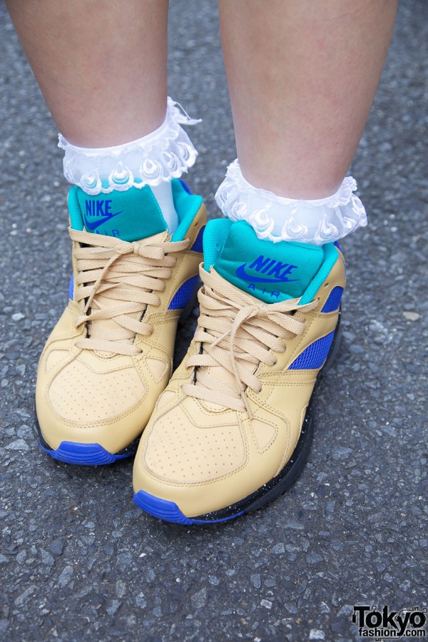 Tan & blue Nike sneakers and lace socks