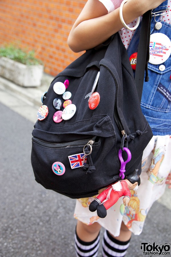 Skunk backpack w/ pop culture buttons & toy