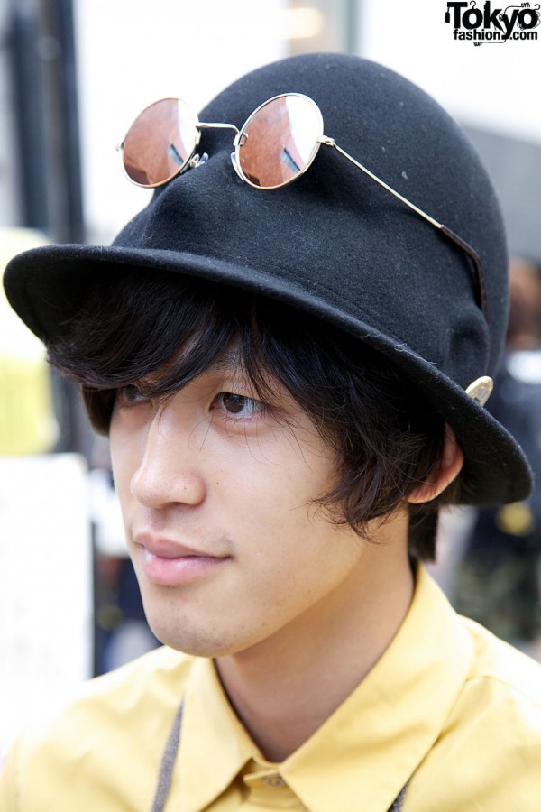 Hat with sculpted face in crown in Harajuku