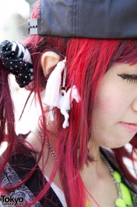 Bright pink hair, tassel & toy