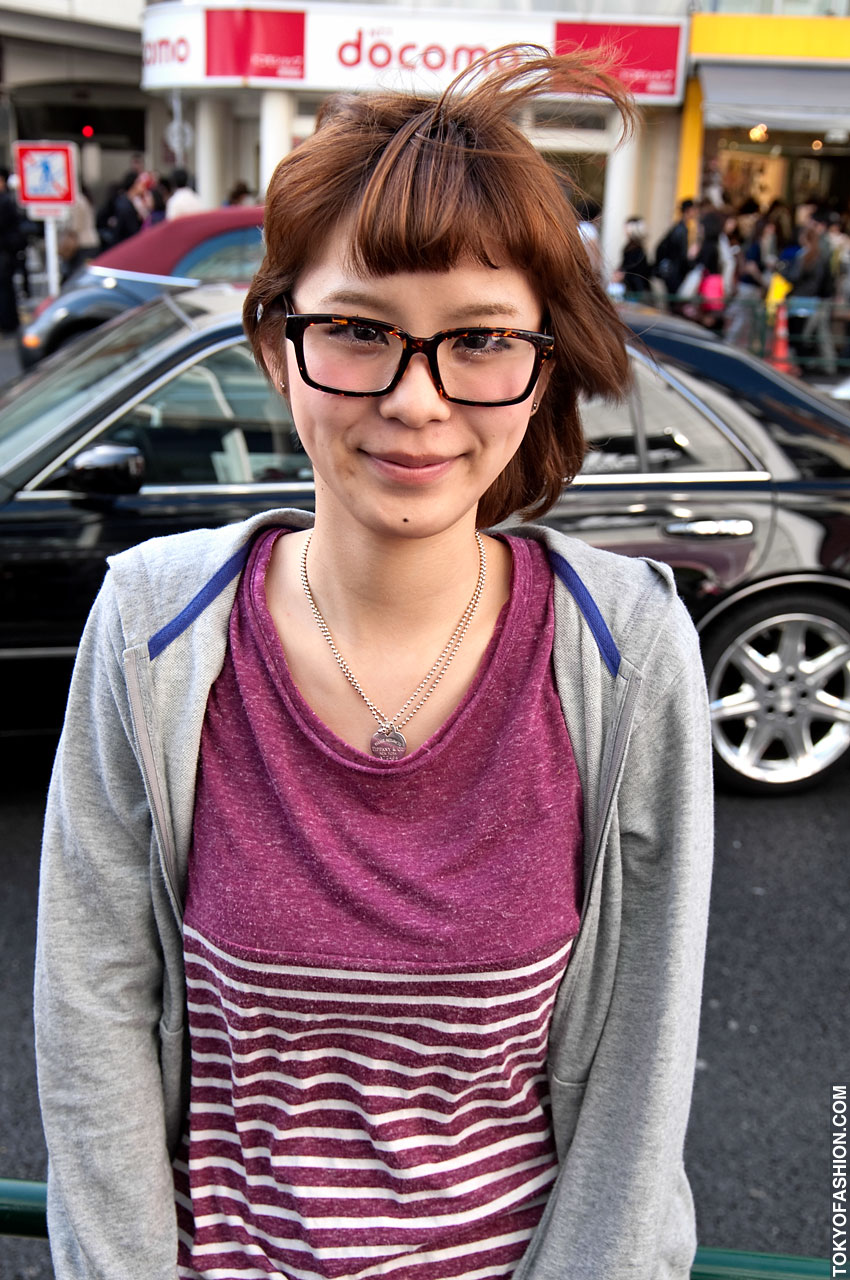 Japanese Glasses Girl And Large Hair Bun In Harajuku Tokyo