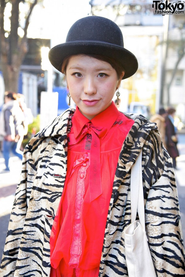 Girl in derby hat with zebra coat in Harajuku