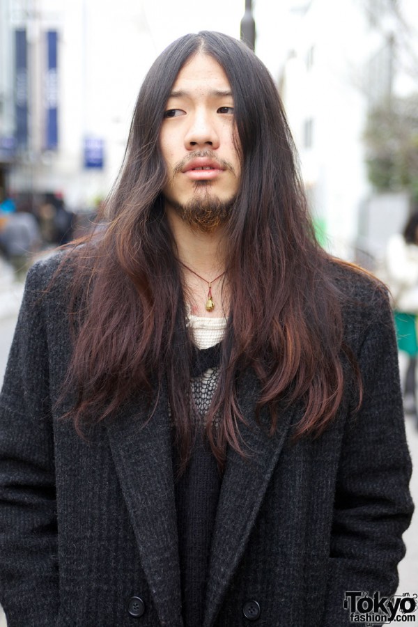 Long haired guy w/ overcoat & pendant necklace