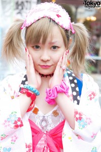 Shushu (scrunchie) on wrist & colorful plastic bracelets