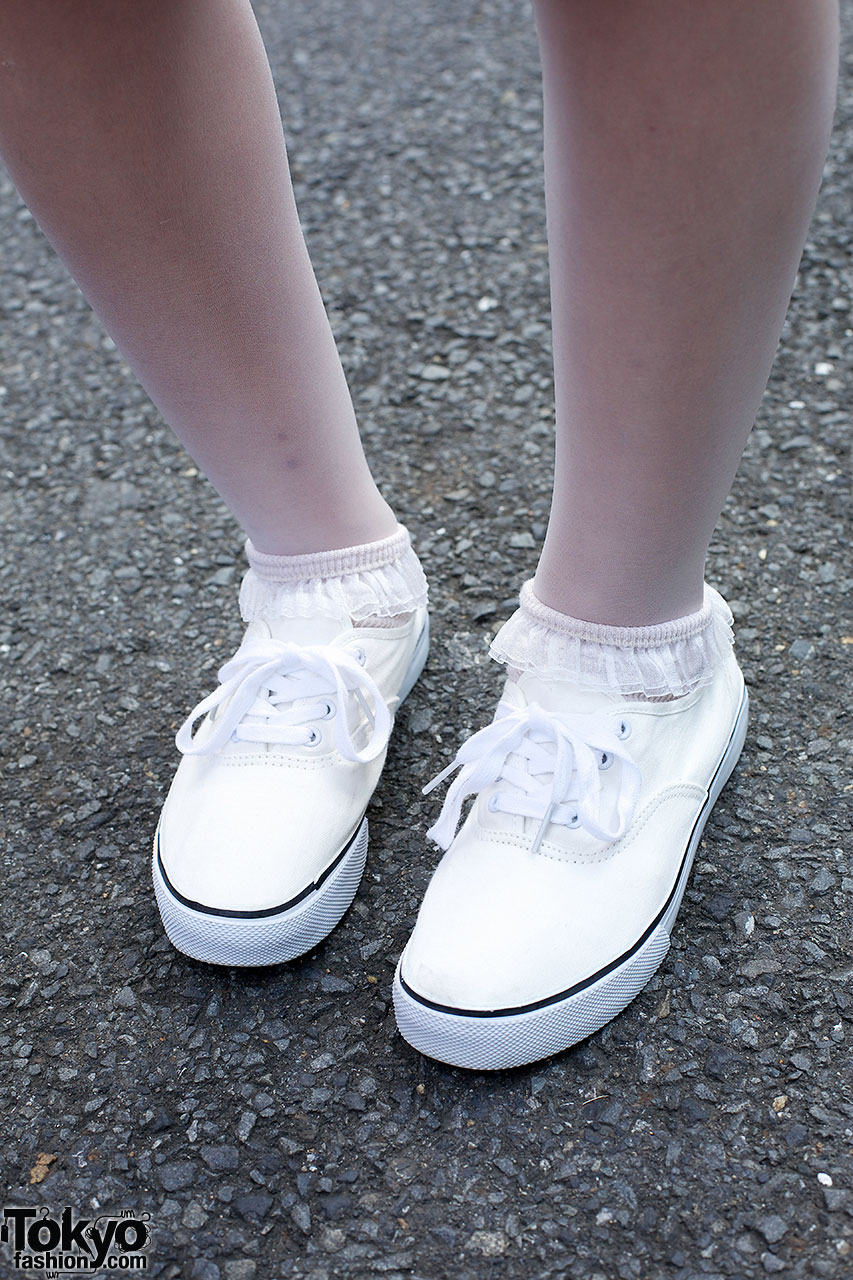 A Person Wearing White Socks and White Sneaker Shoes · Free Stock Photo