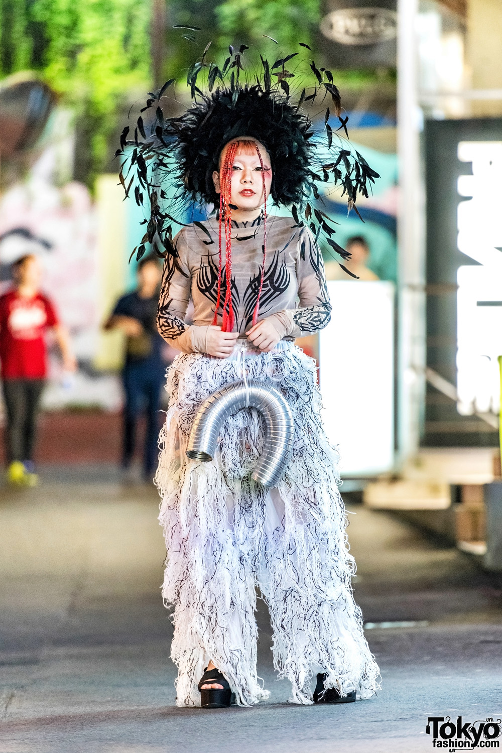 Avant-Garde Harajuku Street Style w/ Dolls Kill Tattoo Print Top, Remake Furry Pants, Platform Sandals & Feather Headdress