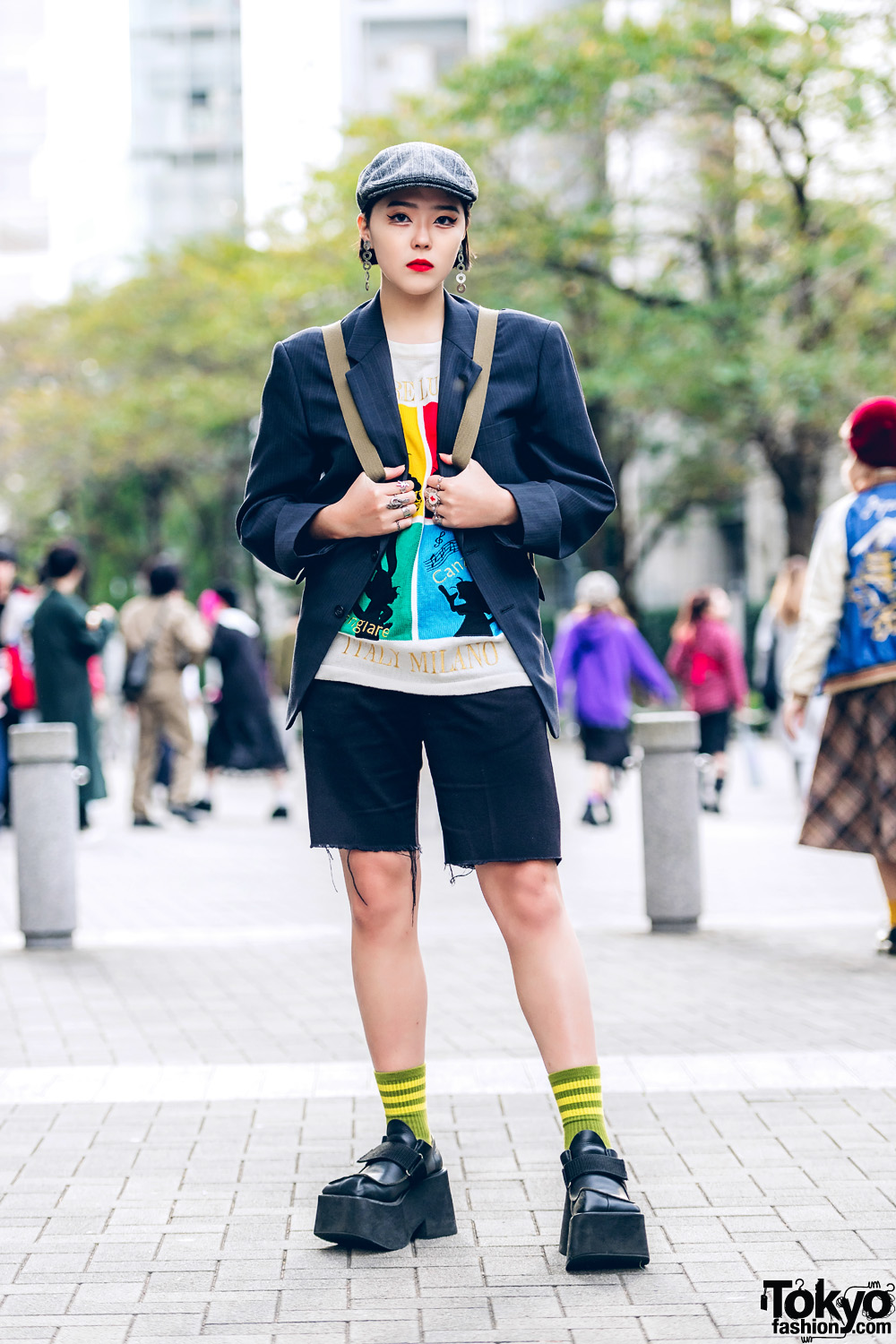 Harajuku Girl in Vintage Streetwear Style w/ Newsboy Cap, Pinstriped Blazer, Dickies Shorts & Mary Quant Backpack