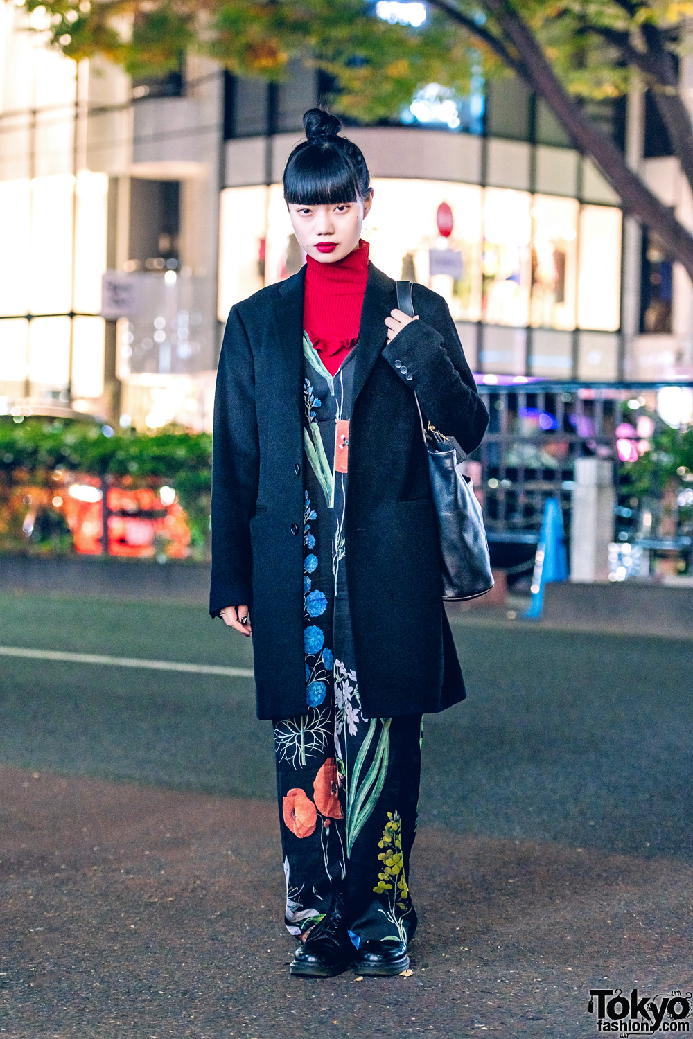 Nylon Japan Blogger in Chic Streetwear Style w/ UNIQLO Coat, Ahcahcum.Muchacha Floral Jumpsuit, Turtleneck, Coach Leather Tote & Dr. Martens