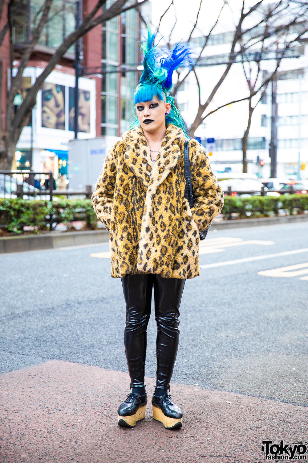 Japanese Fashion Buyer's Street Style w/ Tall Blue Hair, Furry Leopard Coat, Patent Leather Side Zip Pants, Rocking Horse Shoes & Black Makeup