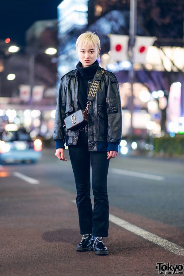 Chic All Black Tokyo Street Style w/ Blonde Pixie Cut, Faux Leather Jacket, Zara Denim Pants, Dr. Martens & Marc Jacobs Bag