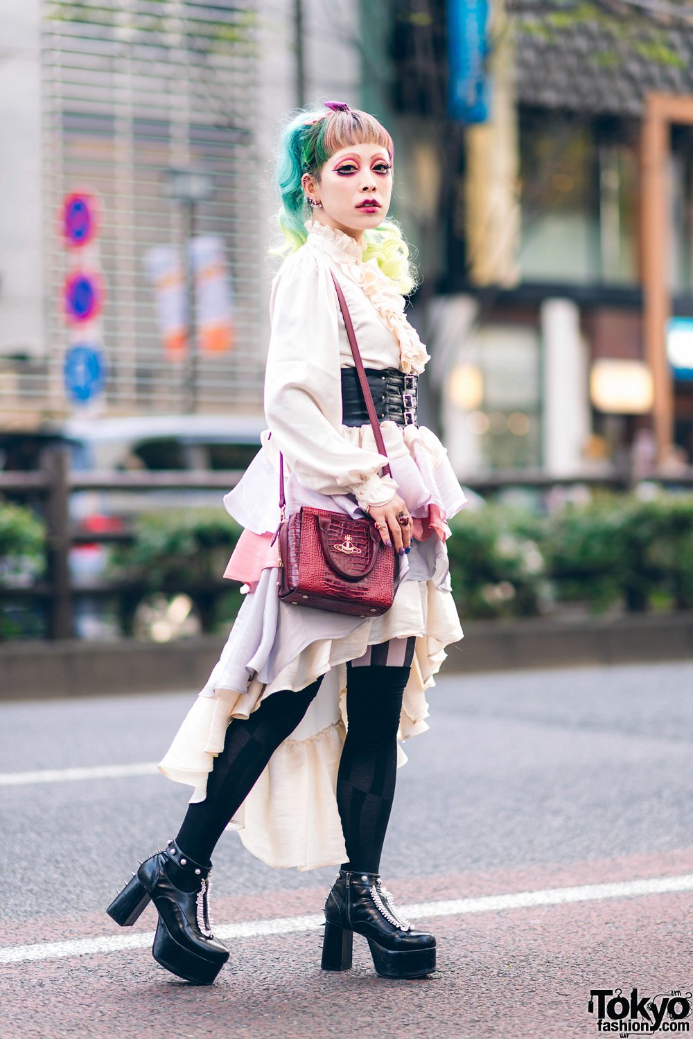 6%DokiDoki Staffer in Chic Ruffle Street Fashion w/ Colored Hair, Red Eye Makeup, Belted Corset, 6D High Low Tiered Skirt, Vivienne Westwood Sling & Disturbia Clothing Platforms