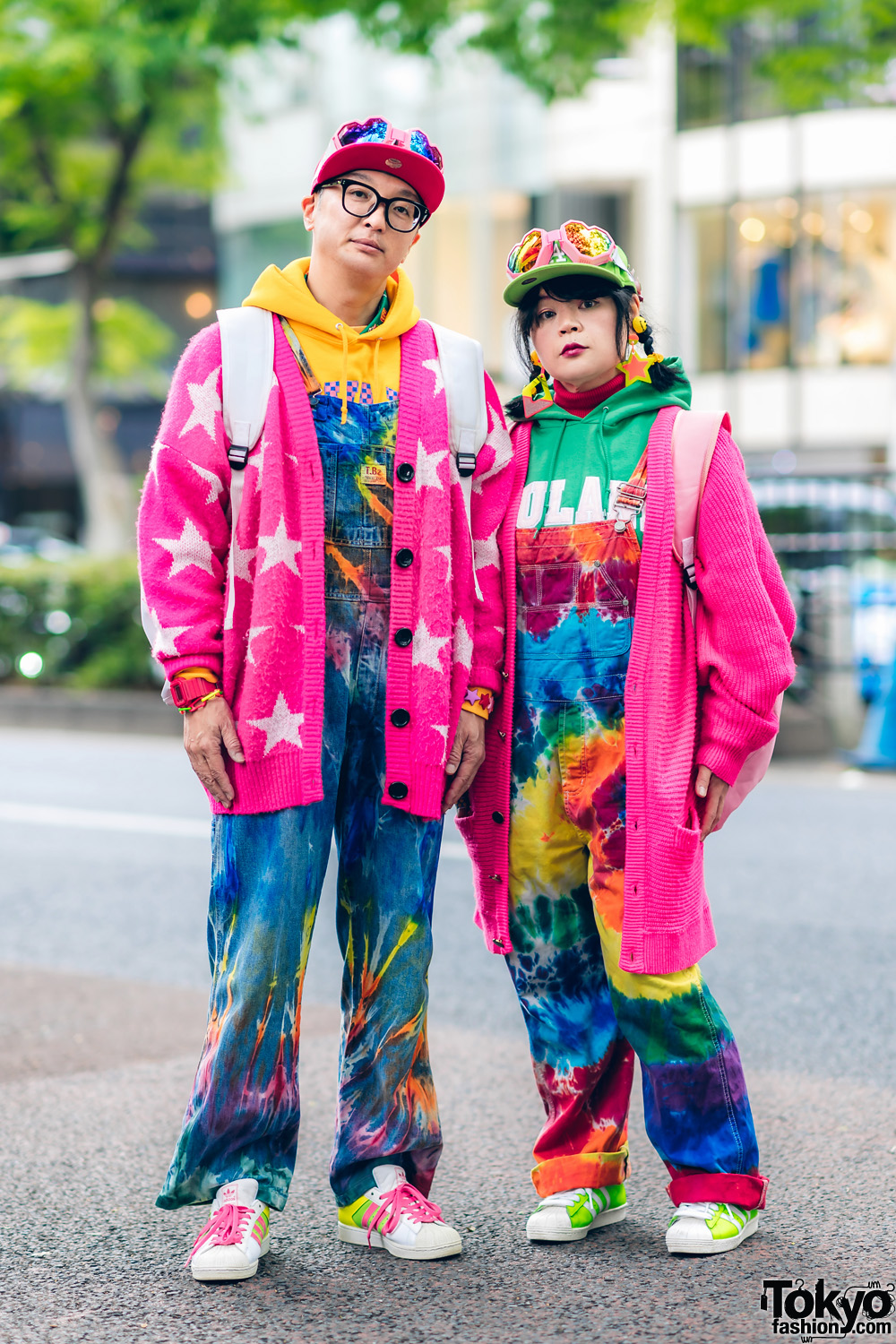 Colorful Harajuku Married Couple Street Fashion w/ Heart Goggles, Tie Dye Overalls, Joyrich Cardigans, New Era, Galaxxxy x Sega Dreamcast Backpack, Adidas & 6%DokiDoki