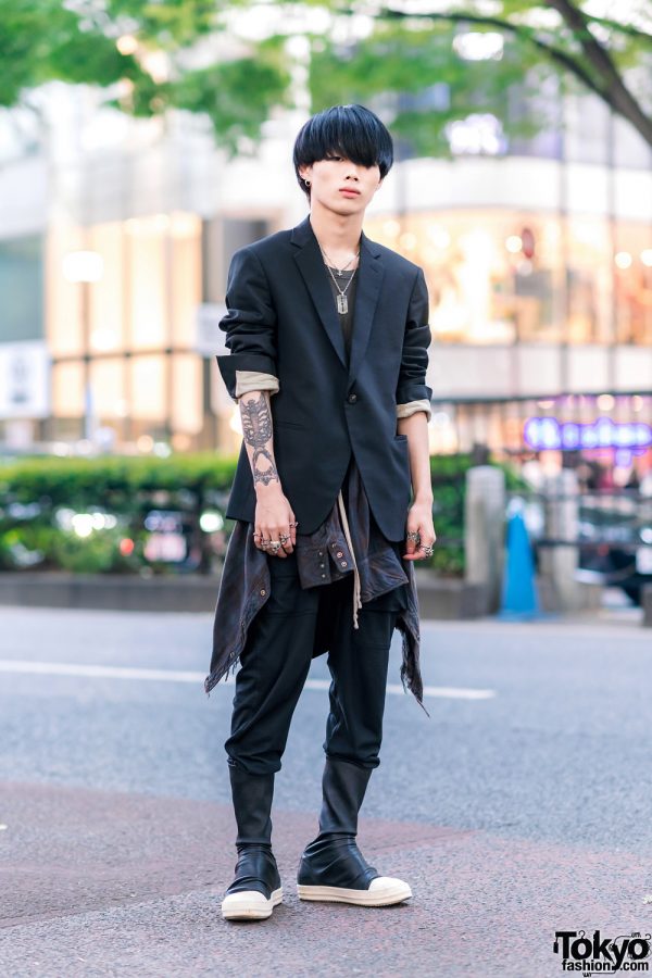 Rick Owens Menswear Street Style w/ Blunt Bob, Blazer w/ Rolled Sleeves, Plaid Shirt Tied Around Waist, Layered Necklaces, Tokyo Human Experiments Knuckle Rings & Mid-Calf Sneakers