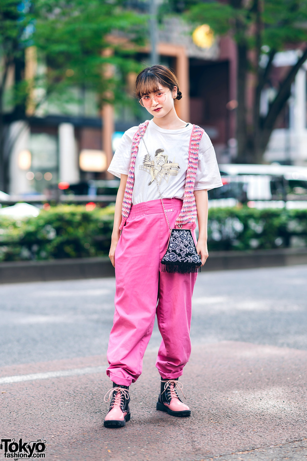 Pink Tokyo Street Style w/ Braided Buns, Pink Glasses, Knit Vest, Printed Shirt, Cherokee Cuffed Pants, Fringed Bag & Yosuke Two-Tone Boots