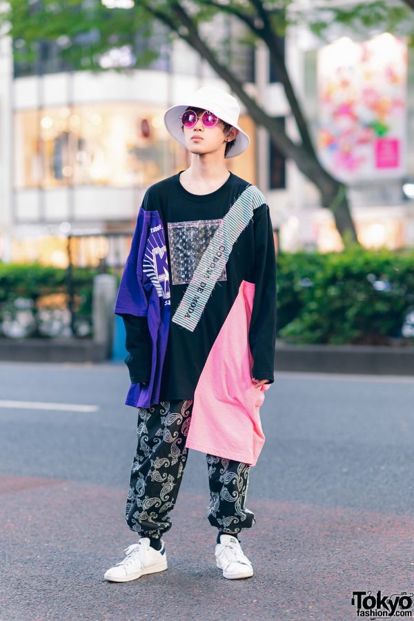 Casual Street Look in Harajuku w/ Bucket Hat, Pink Sunglasses, Codona De Moda Asymmetric Sweatshirt, Paisley Print Pants & Adidas Sneakers