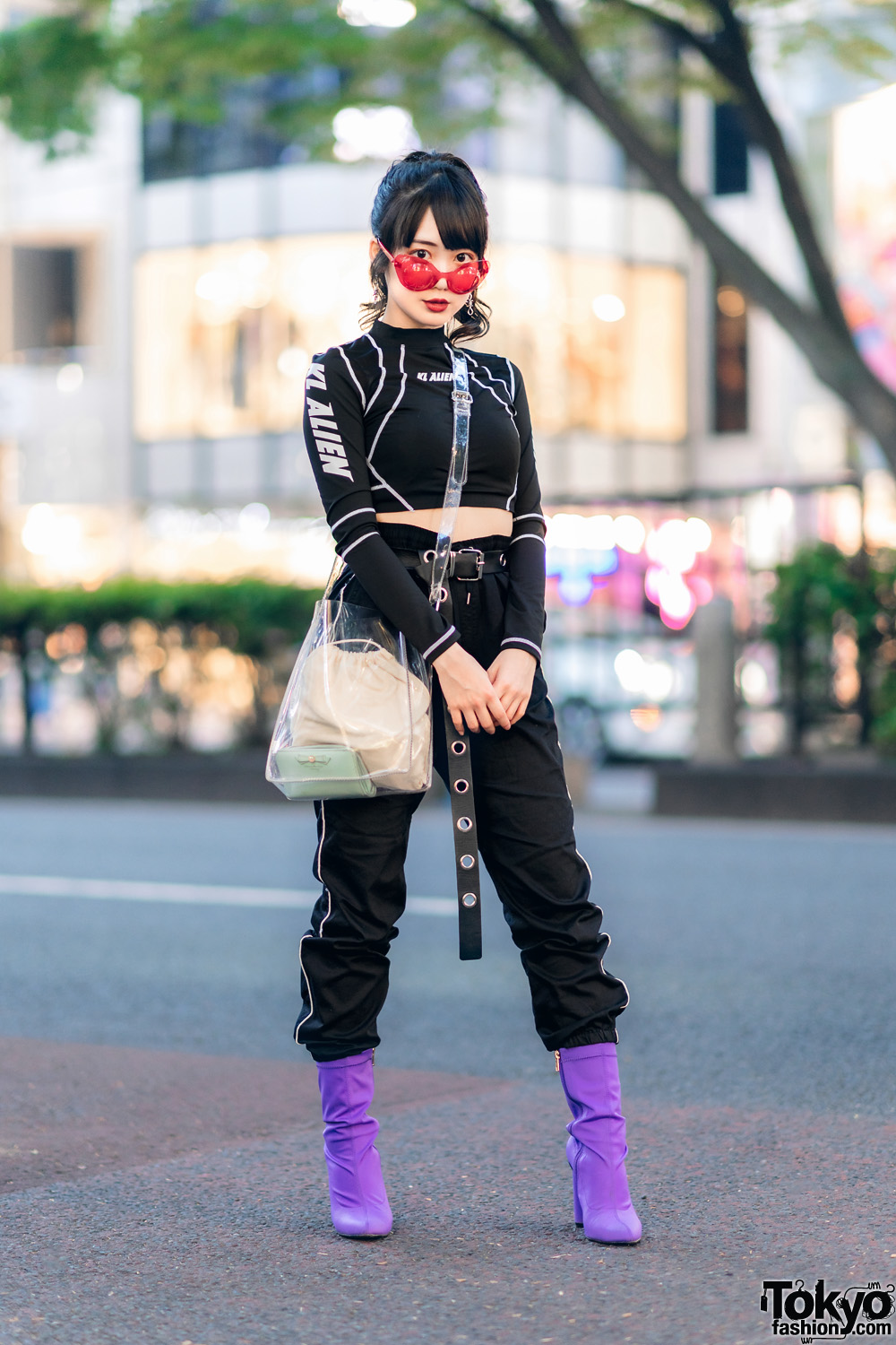 Japanese Idol in KL Alien Crop Top, Striped Track Pants, Clear Bag & Purple Sock Boots in Harajuku
