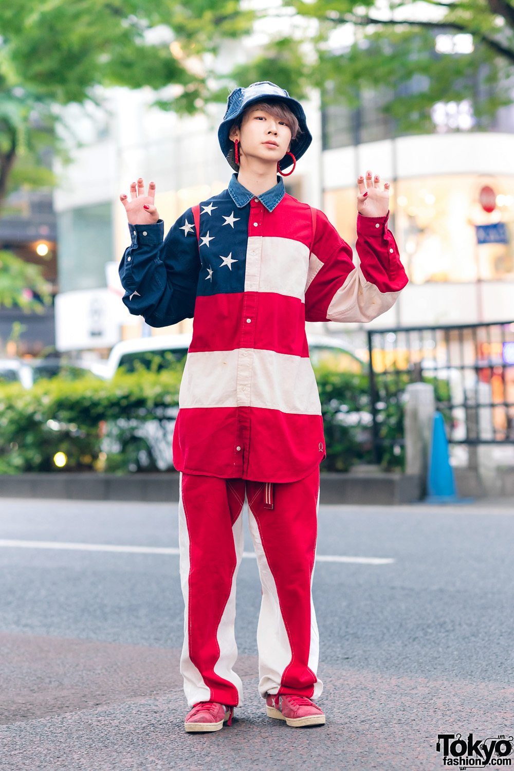 Americana-Themed Streetwear Style in Harajuku w/ Denim Bucket Hat, Gallerie Hoop Earrings, Tommy Hilfiger Stars & Stripes Shirt, M&Ms Backpack & Converse Suede Sneakers