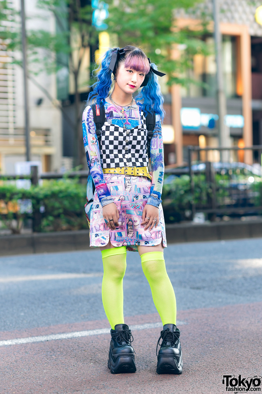 Harajuku Girl's Graphic Street Style w/ Blue Twin Tails, Checkered Top, Manga Skirt, Neon Fishnets, Sprayground Backpack & Demonia Platforms