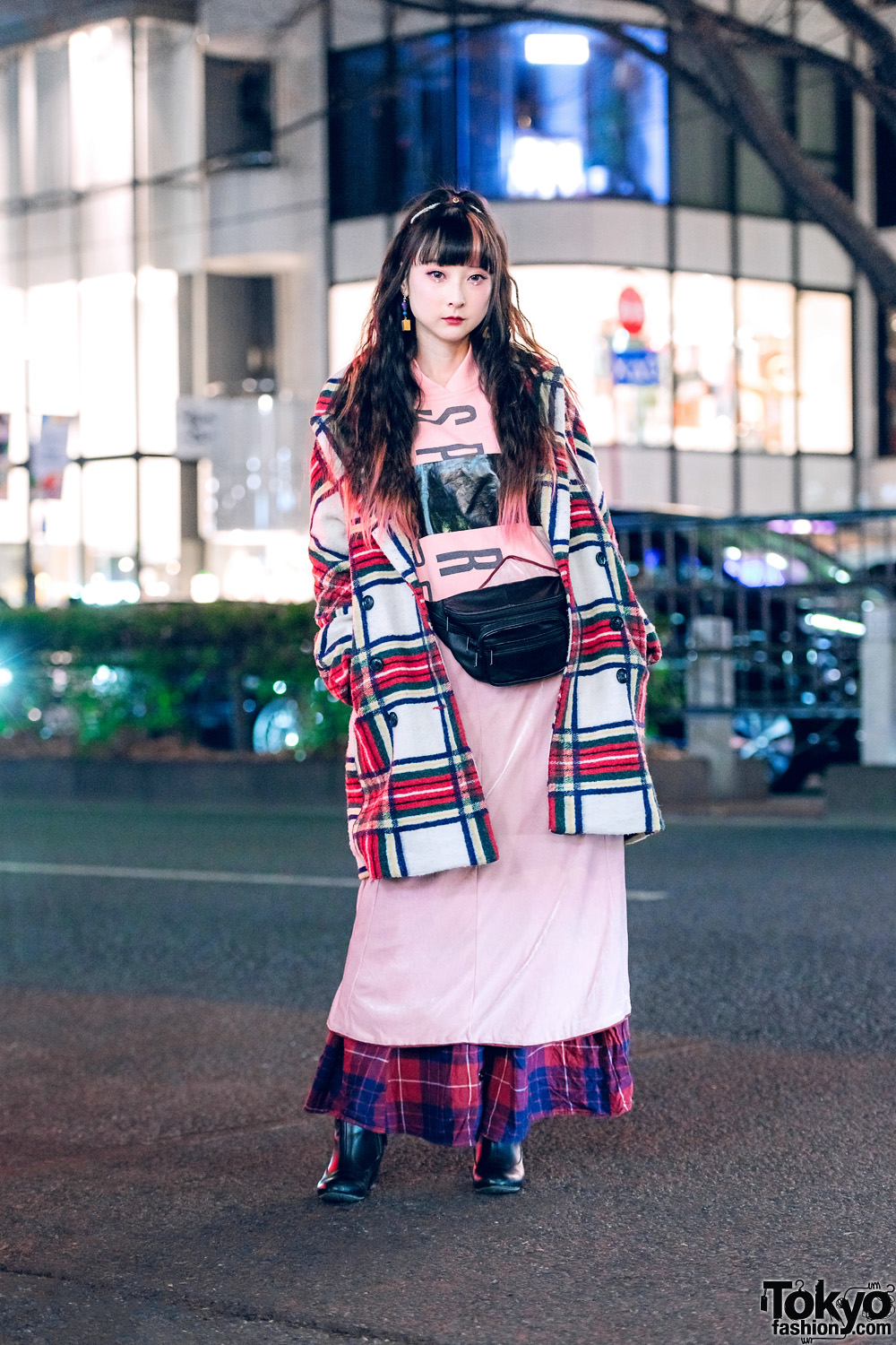 YouTuber RinRin Doll in Harajuku w/ Curly Pink-Streaked Hair, Eye Jewels, Desigual Plaid Coat, Yeah Right Hoodie Dress, Plaid Maxi Skirt, Vintage Kinsella Waist Bag, Miu Miu & Jelly Beans
