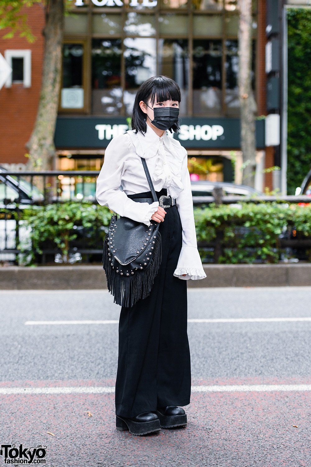 Minimalist Monochrome Street Style w/ Black Mask, Ruffle Shirt, Flared Pants, Fringed Shoulder Bag & Demonia Platform Boots
