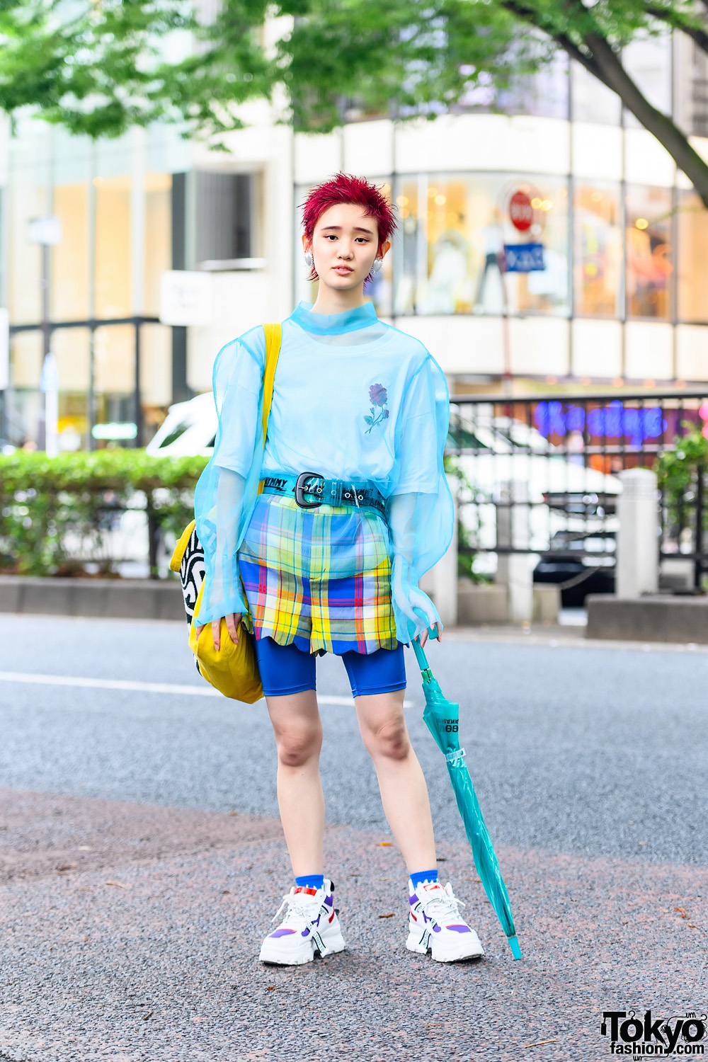 Model in Teal and Yellow Sheer Fashion w/ Pink Bob Hairstyle, Dew E Dew E Sheer Top, Aymmy In The Batty Checkered Scalloped Hem Shorts, Little Sunny Bite Tote, Jaynise Sneakers, Clear Belt, Clear Umbrella & Heart Earrings