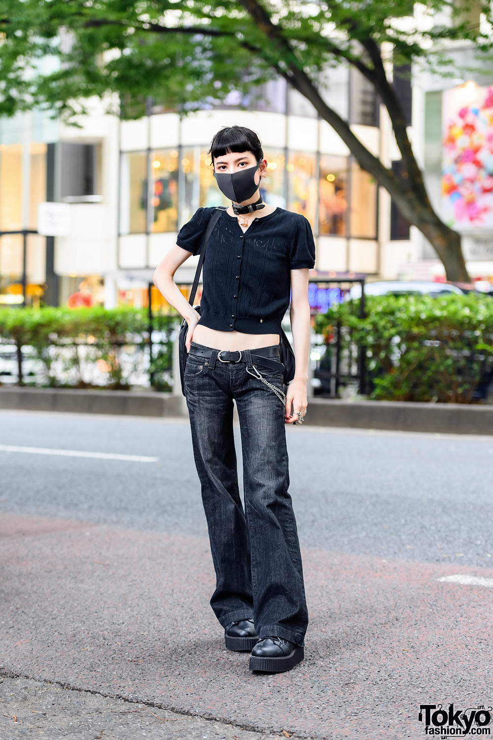 Model in All Black Street Style w/ Milk Knitted Cropped Blouse, Moussy Vintage Flared Jeans, Demonia Platform Shoes, Comme Des Garcons Bag, Tokyo Human Experiments & Vivienne Westwood Accessories