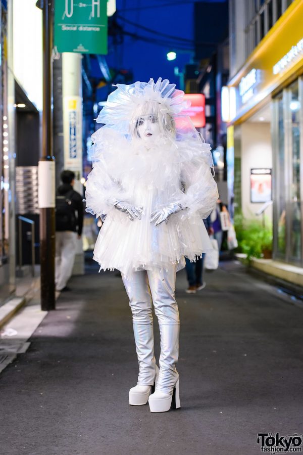 Japanese Shironuri Artist Minori in Handmade Recycled Clear Umbrella Fashion w/ Feather Eyelashes, Veiled Headdress, Silver Gloves & Platform Boots