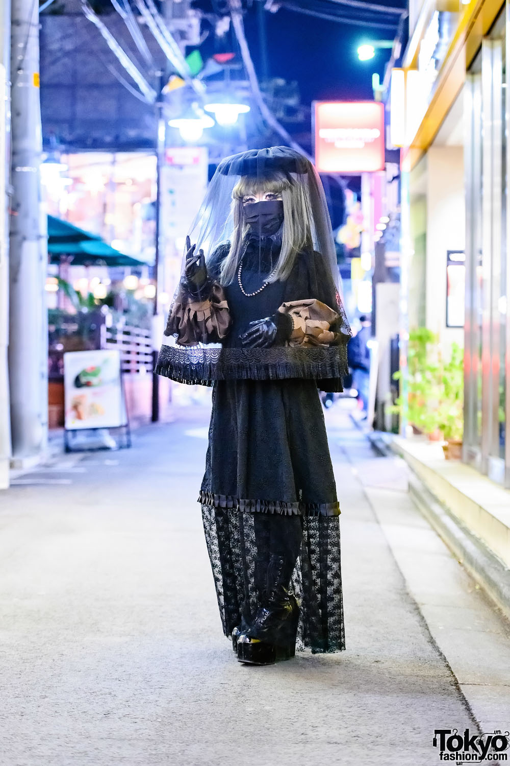 Japanese Shironuri Artist Minori Wearing A Handmade Veil & Black Lace On The Street in Harajuku